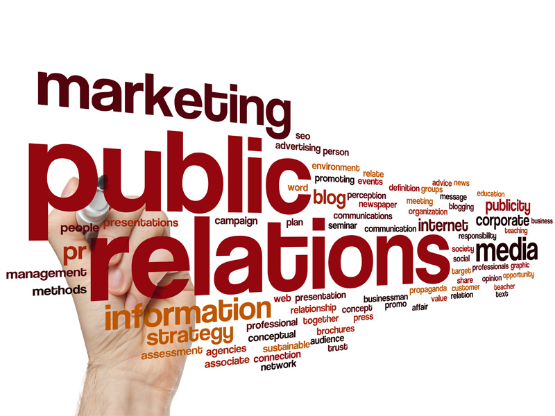 Marketing public relations text with hand