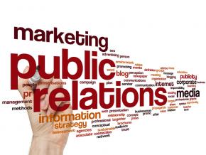 Marketing public relations text with hand